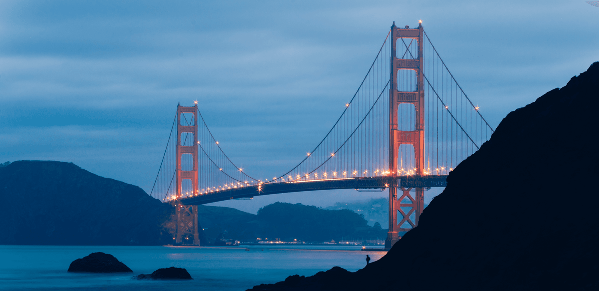 A foggy twilight view of the Golden Gate Bridge in San Francisco, CA